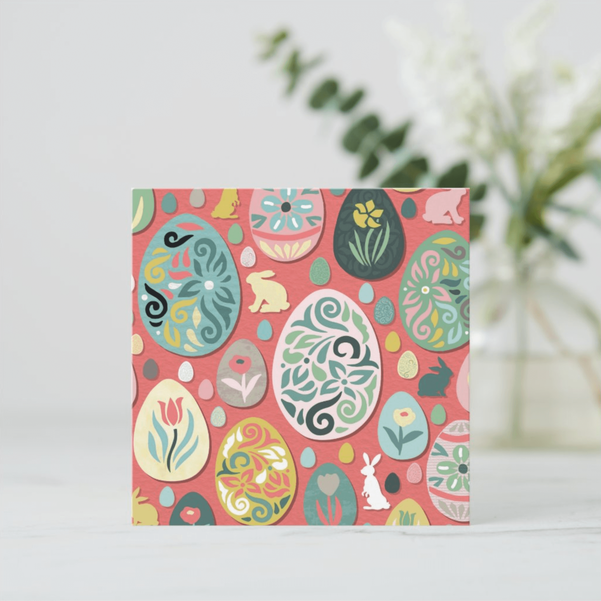 Illustrated greeting card with easter eggs on pink background