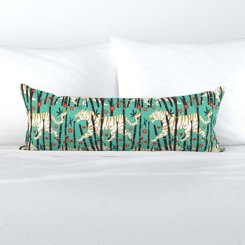 Pillow with white tigers on turquoise background